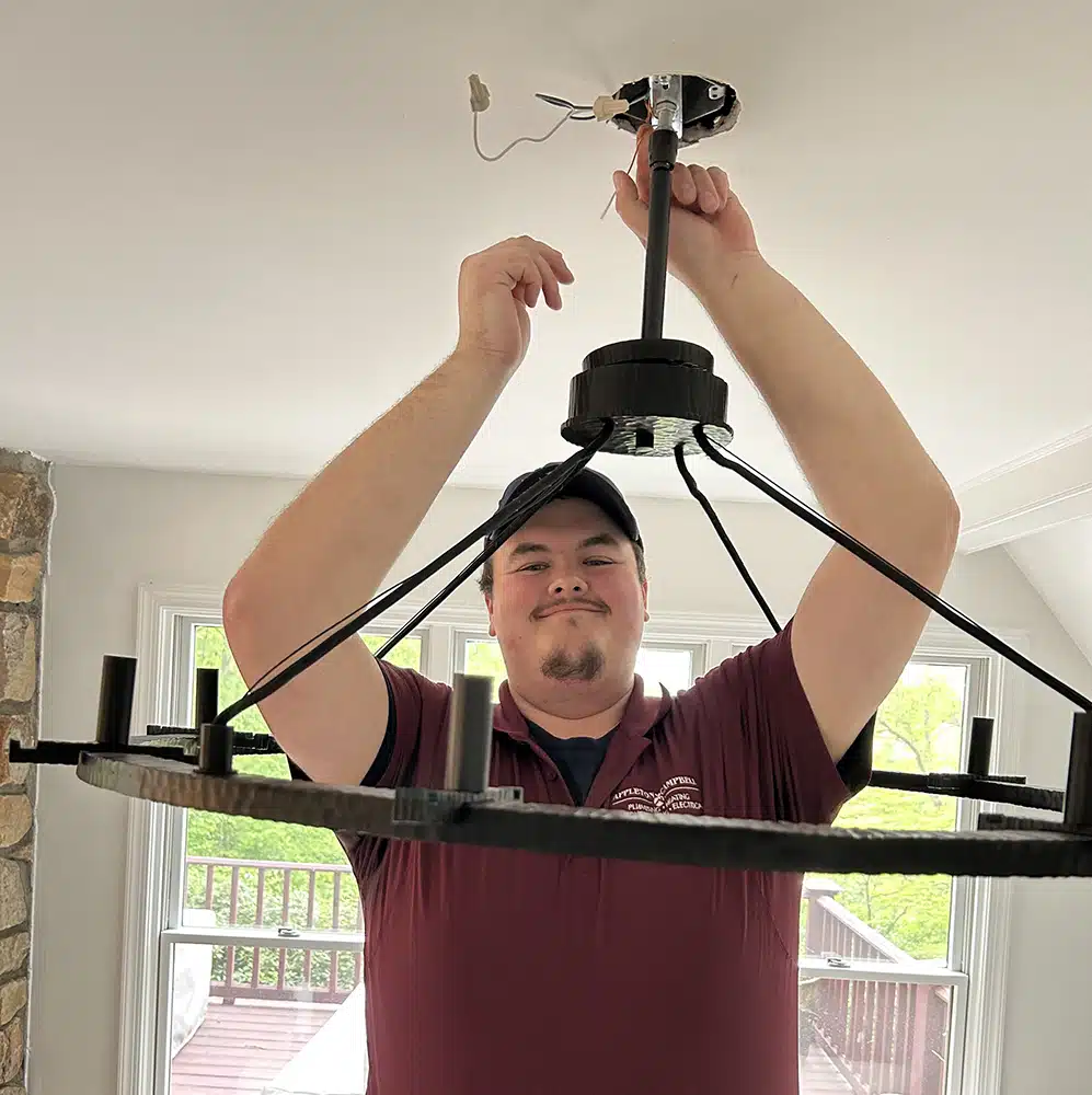 Appleton Campbell technician installing lighting in residential home in Warrenton, VA.