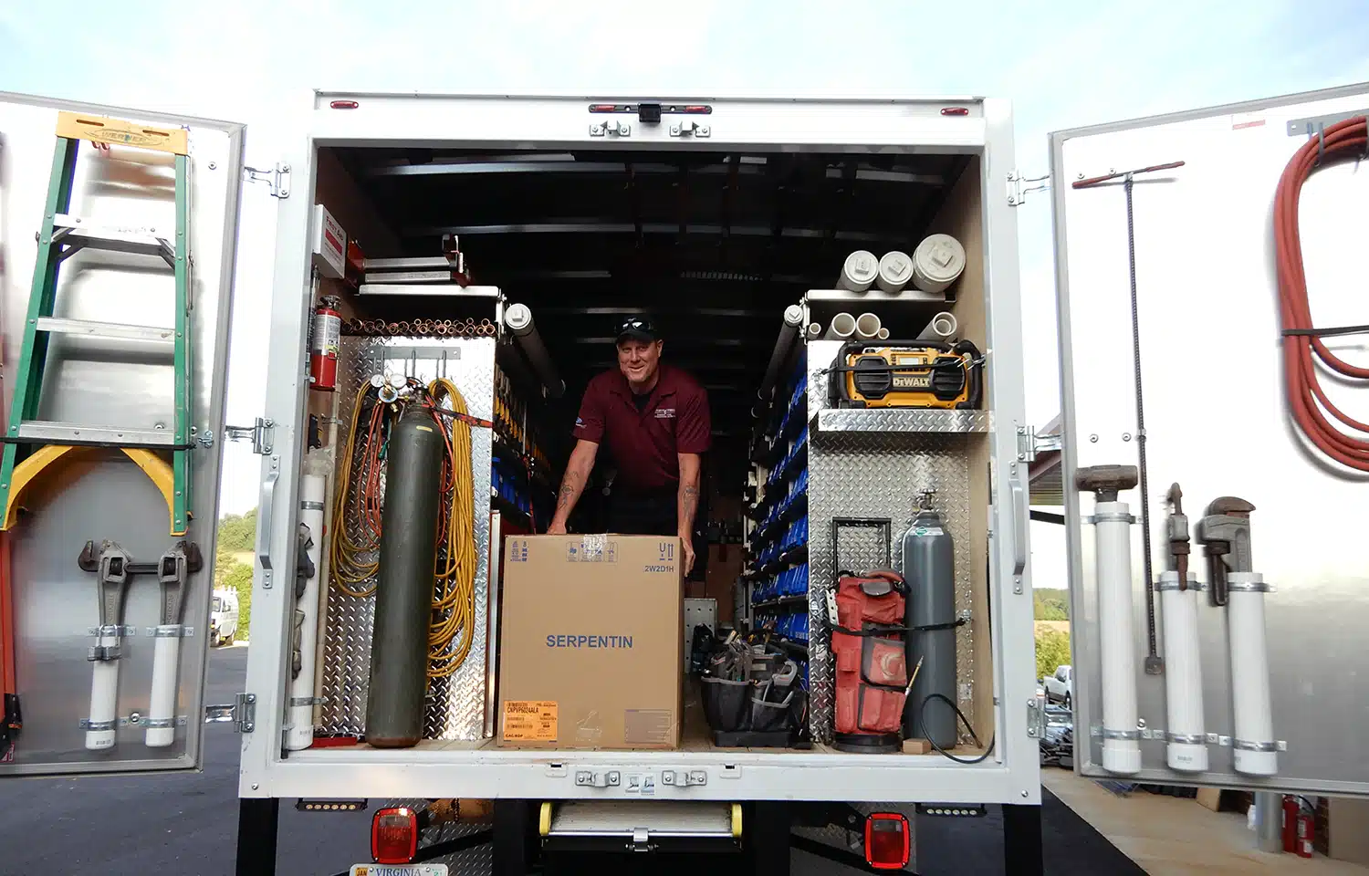 Jason in back of Appleton HVAC truck in Warrenton, VA.