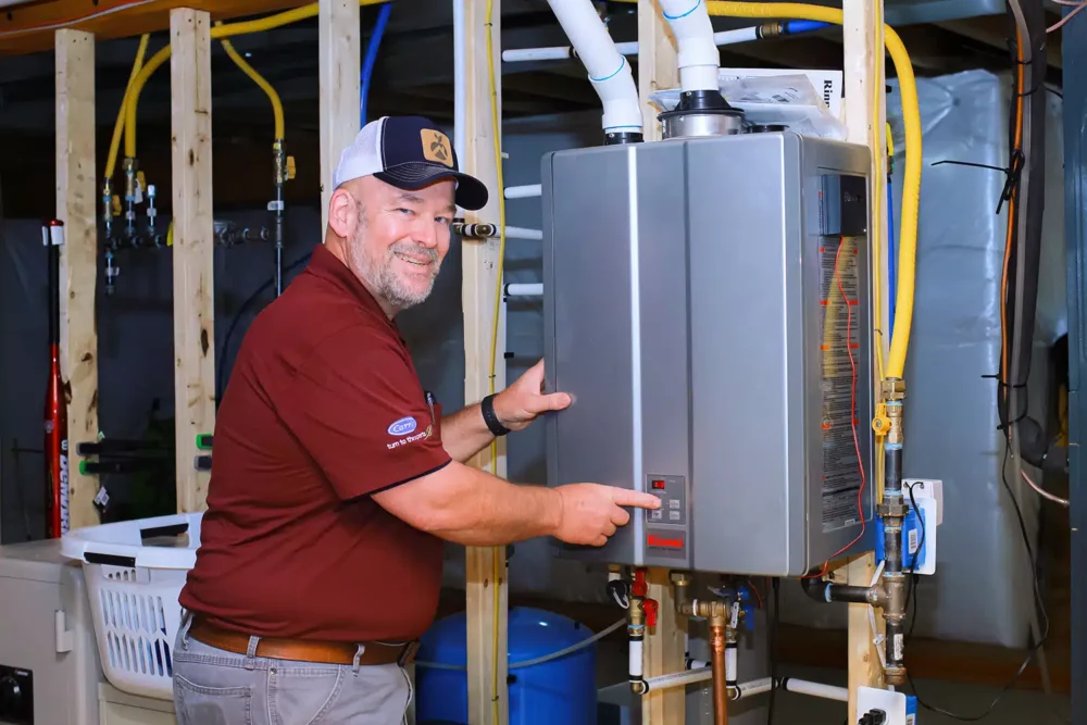Appleton Campbell technician installing tankless water heater in Warrenton, VA.
