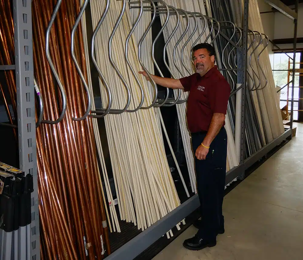 Larry in front of pipe rack inside of Appleton Campbell warehouse in Warrenton, VA.