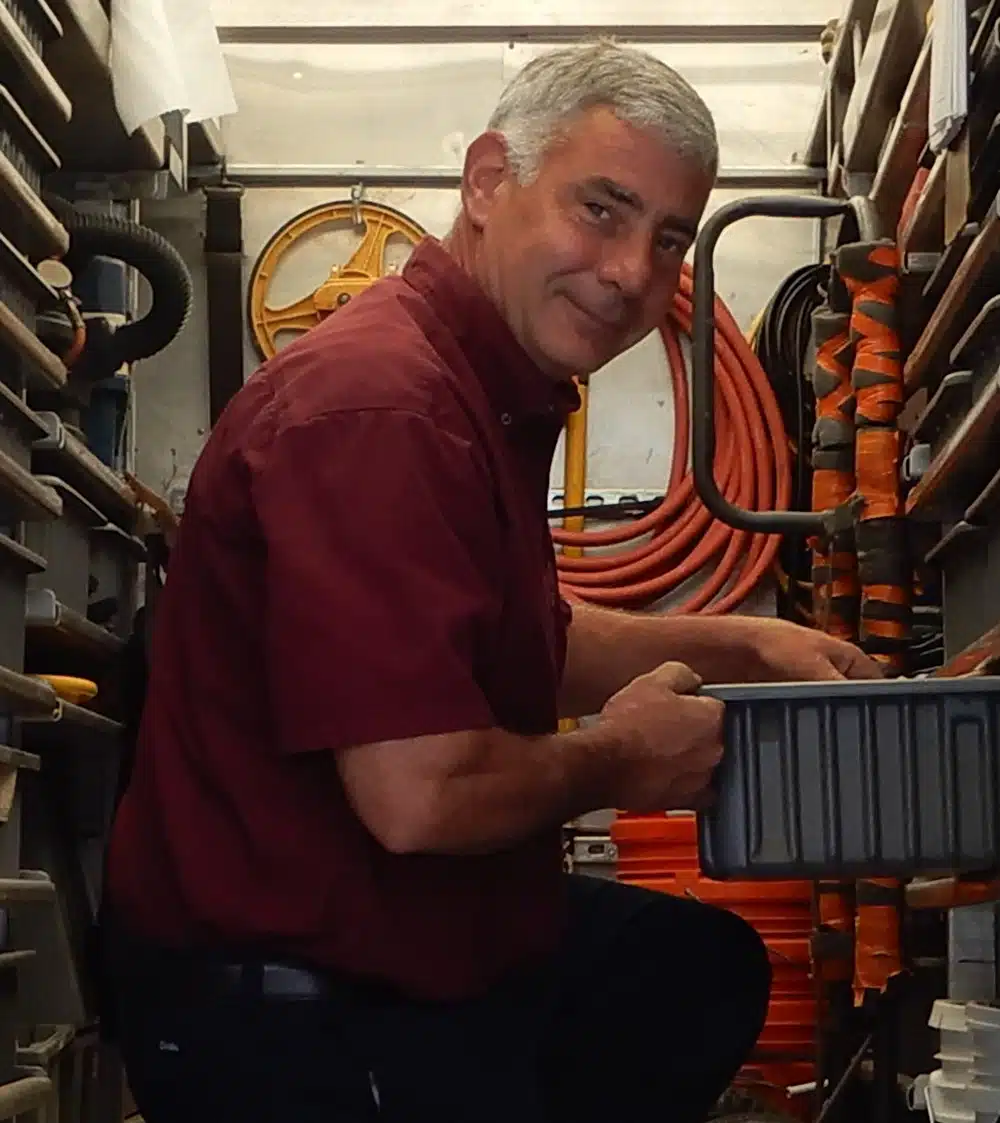 Appleton Campbell plumber inside of service truck in Warrenton, VA.